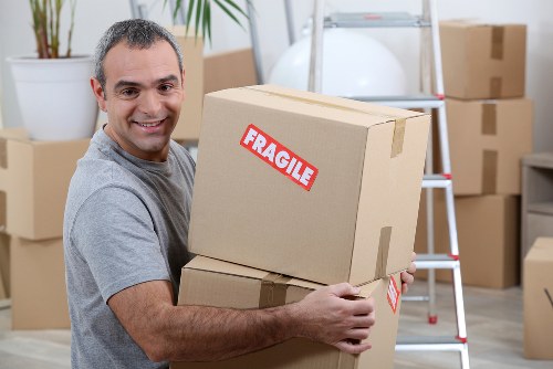 Professional movers packing items in Bromley