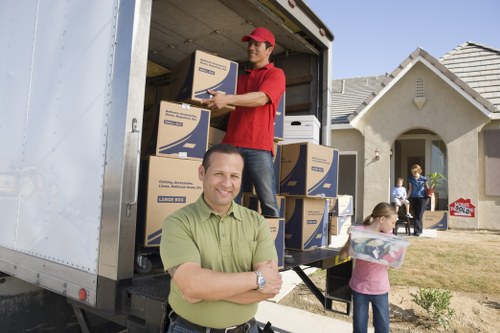 Crew arranging items in removal truck